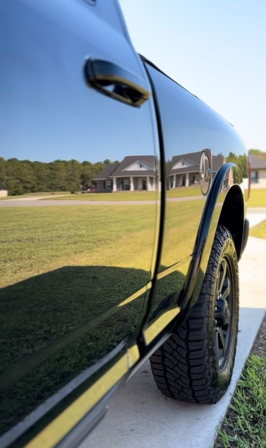 Mirror-like reflection in a freshly detailed truck door